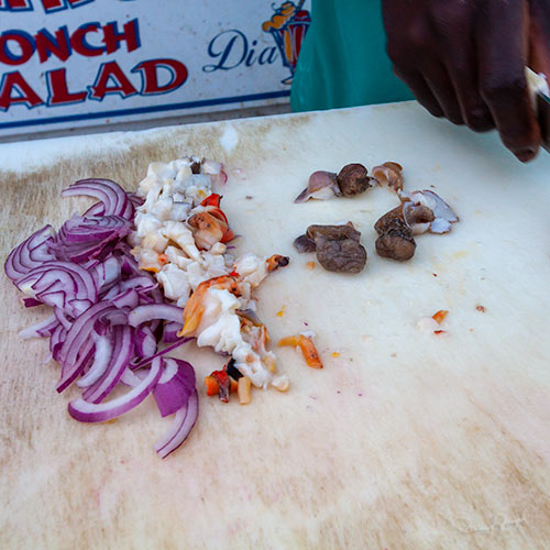 Avian makes conch salad from his recipe.